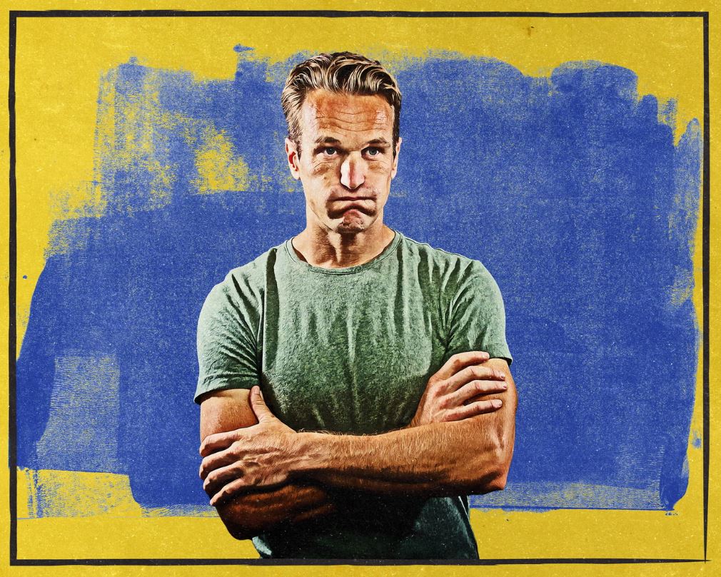 Man with his arms folded, trying to cope with stress.